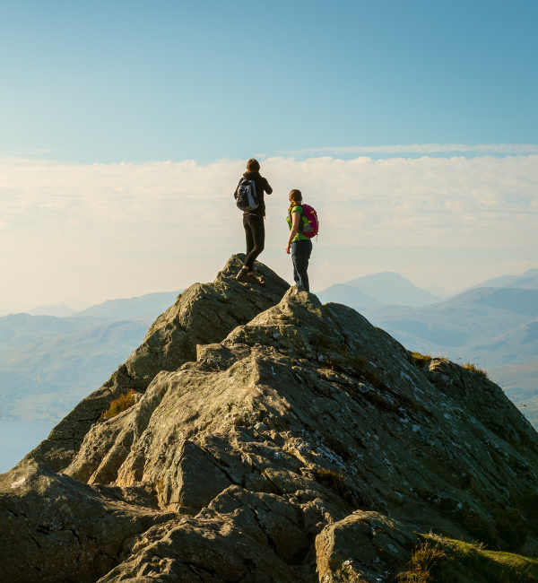 hikers stood on top of mountain