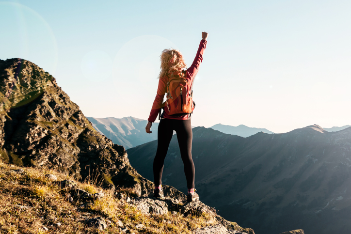 woman on top of mountain